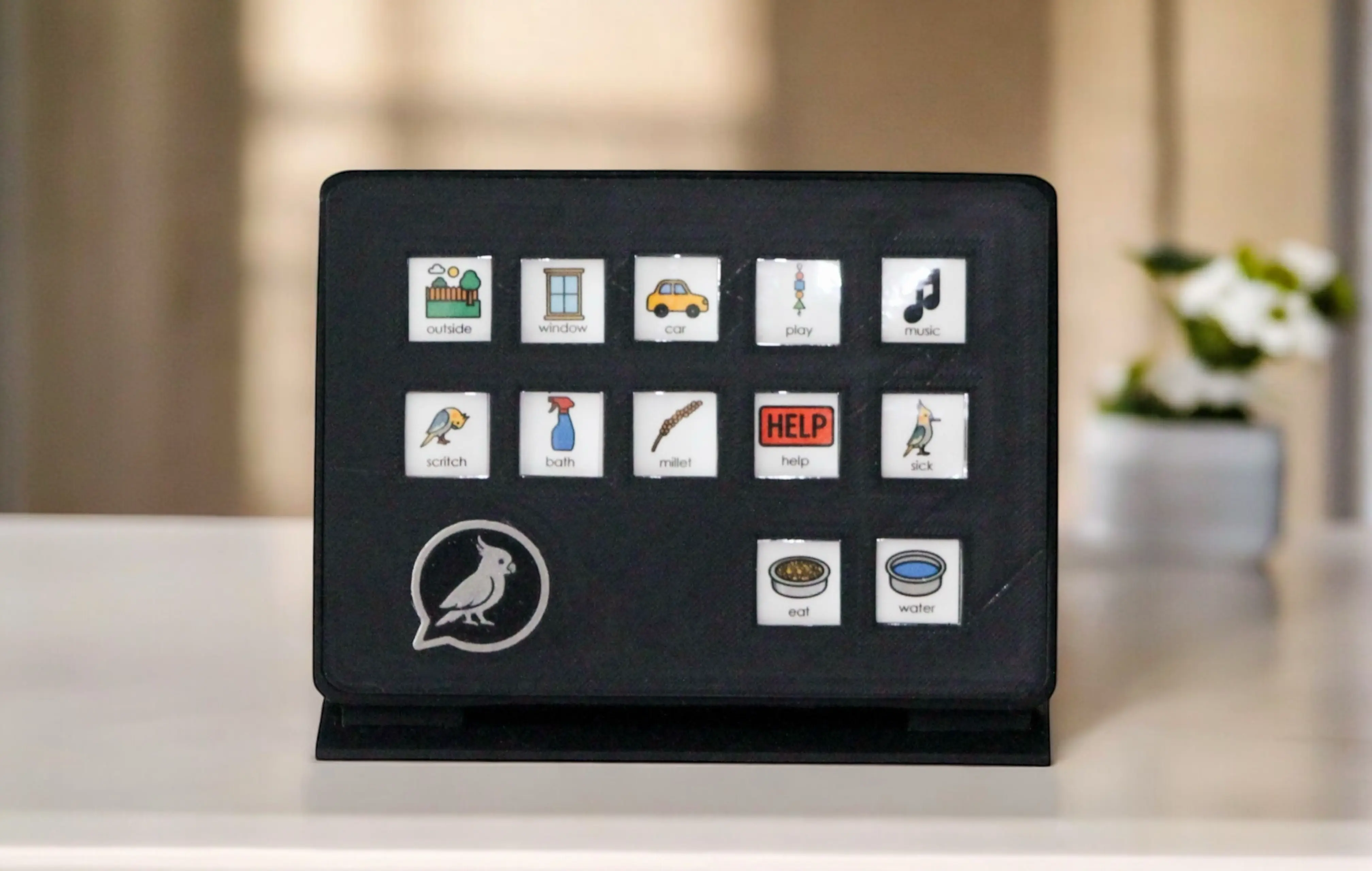 FeatherTalks tablet-style AAC communication board for birds